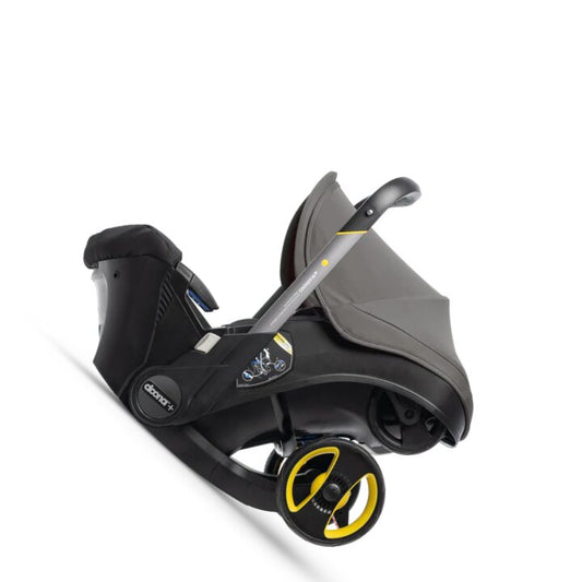 Rear-facing infant car seat with a secure latch base, transforming into a stroller in mere seconds